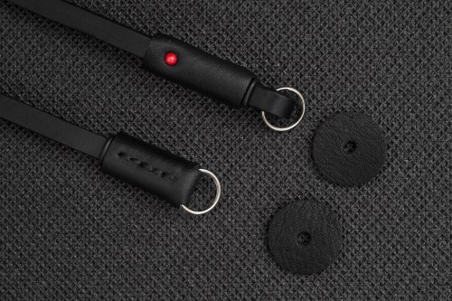 On the top, the leather ending of the Slim strap and Shoulder strap. On the bottom, the smaller leather ending of the mini strap.